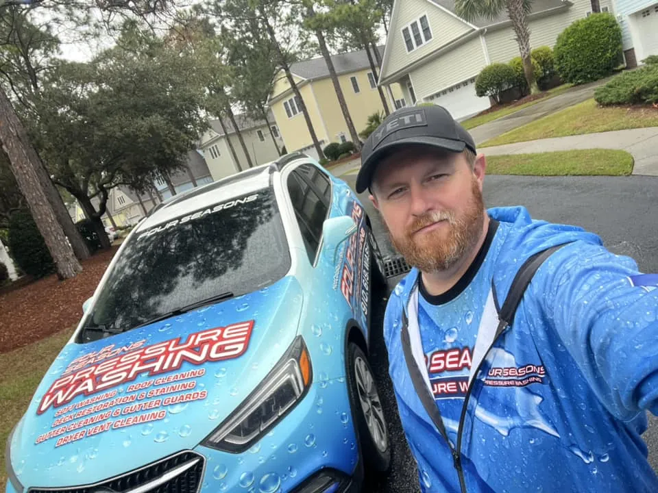 power-washing-truck-on-location-at-residential-driveway-by-front-porch-wilmington-nc