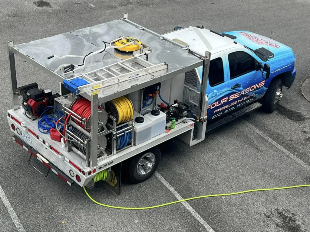 power-washing-truck-side-profile-view-at-residential-driveway-by-swimming-pool-wilmington-nc power-washing-truck-side-profile-view-at-residential-driveway-by-swimming-pool-wilmington-nc