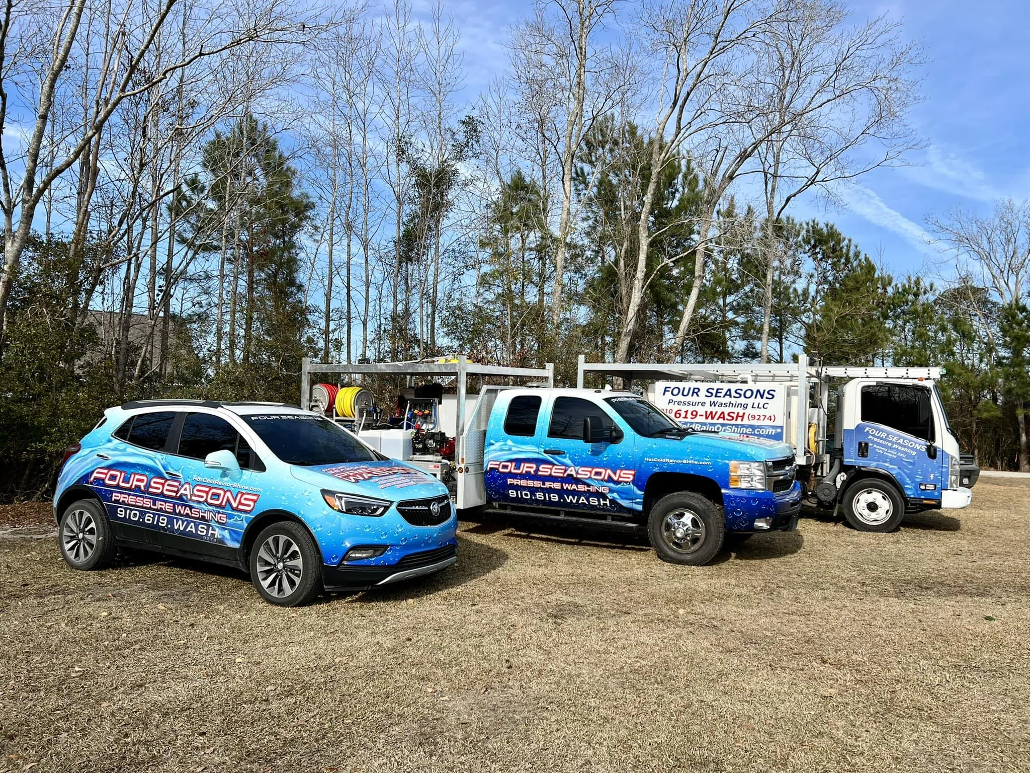 power-washing-truck-side-profile-view-at-residential-driveway-under-oak-trees-wilmington-nc